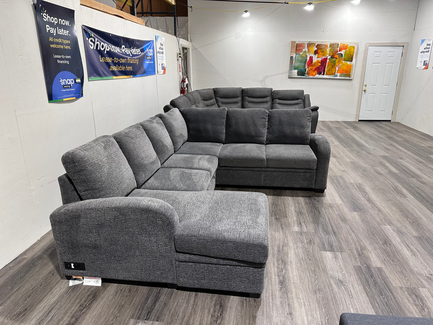 Navy Gray Sectional couch with storage compartment and pull out bed
