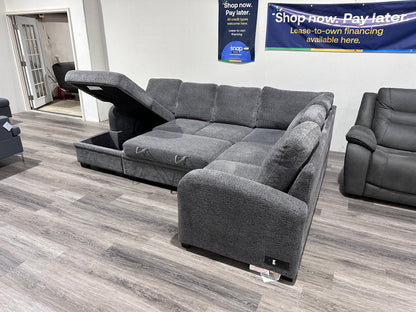 Navy Gray Sectional couch with storage compartment and pull out bed