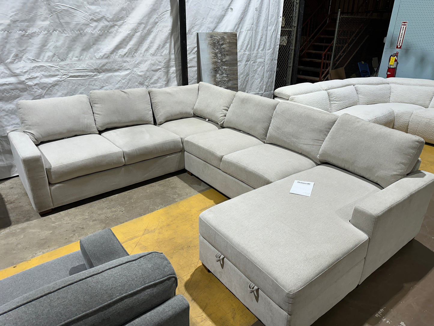 Three-piece beige sectional with storage Chase