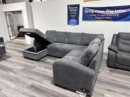 Navy Gray Sectional couch with storage compartment and pull out bed