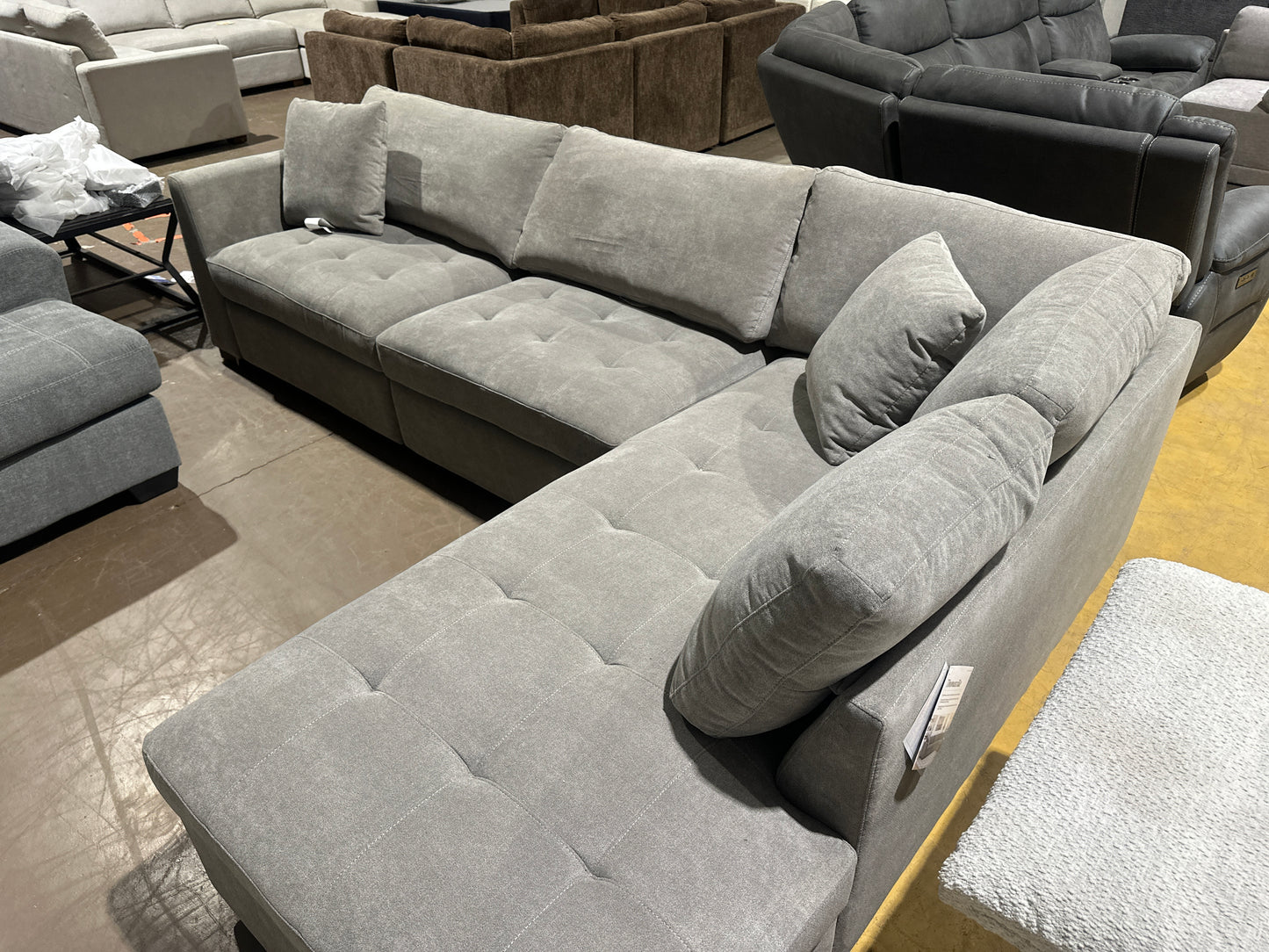 Light grey sofa with power leg rest