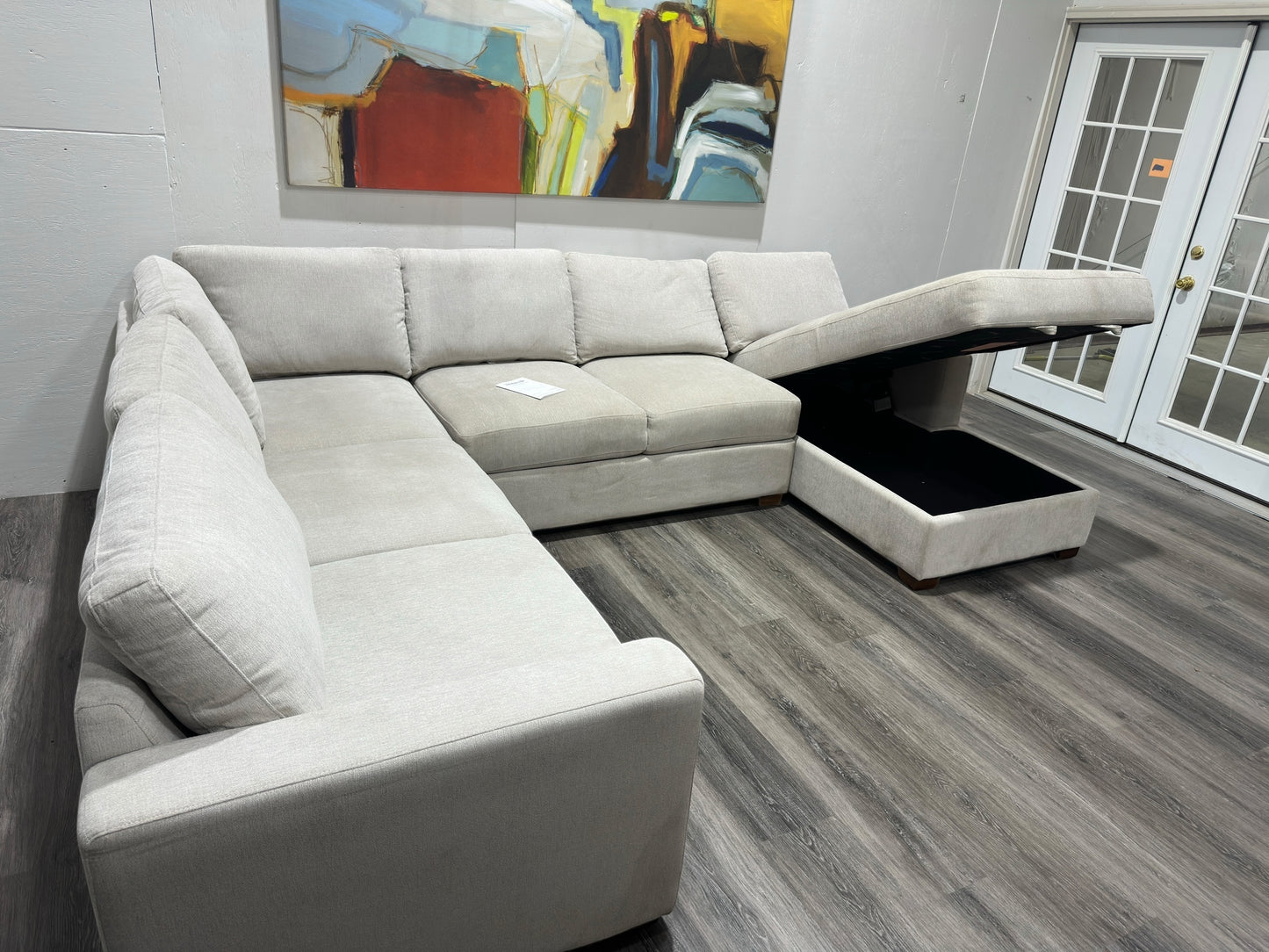 Three-piece beige sectional with storage Chase