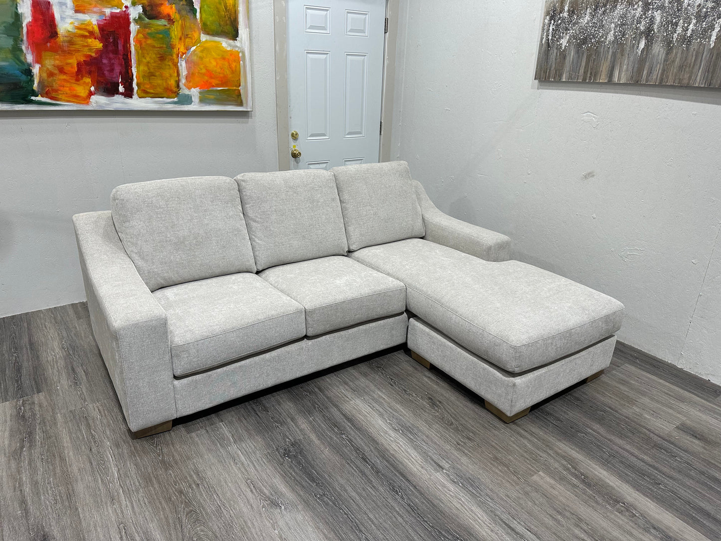 Beige sectional with reversible chase