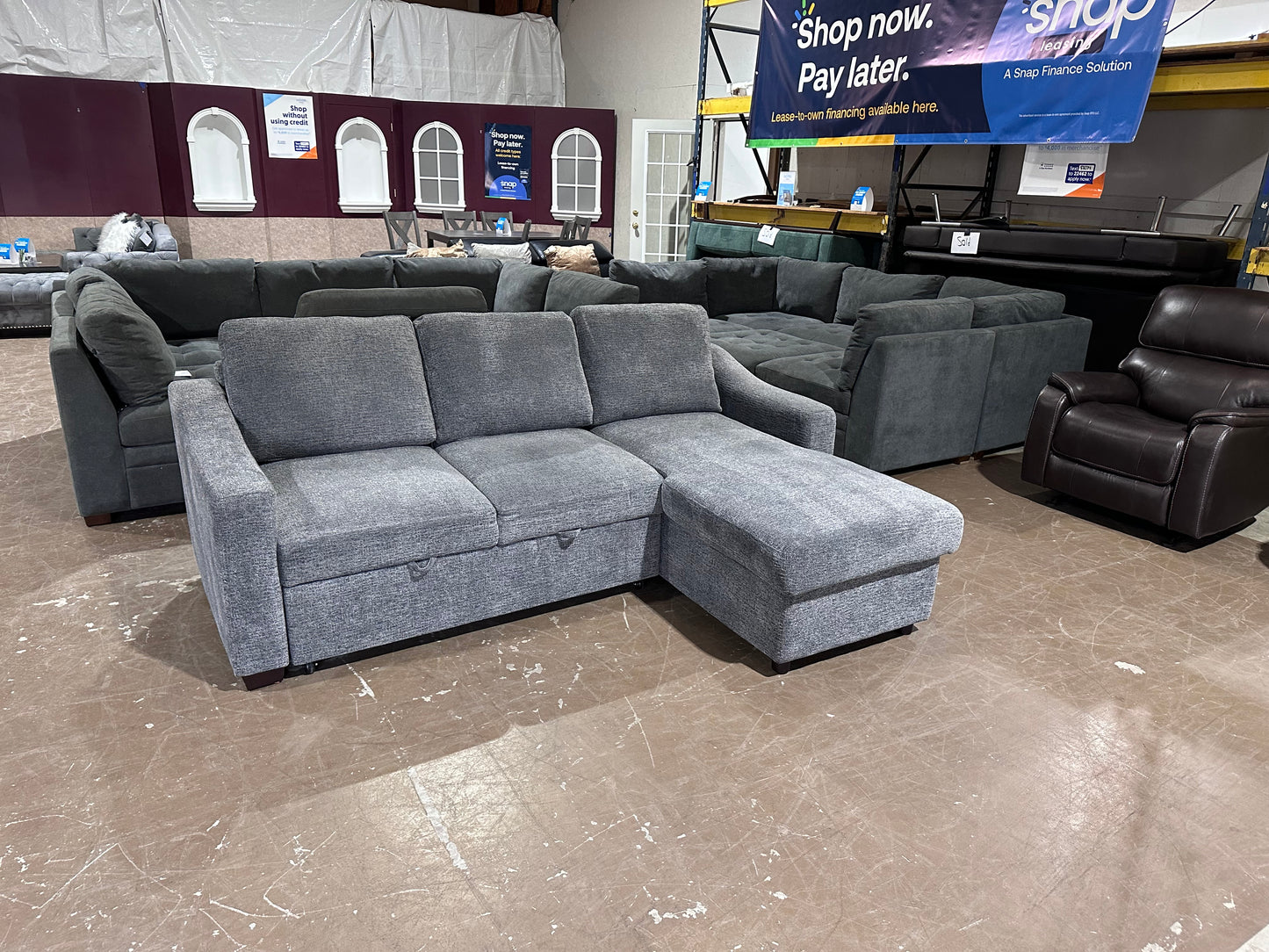 Gray sectional w/ pull out bed