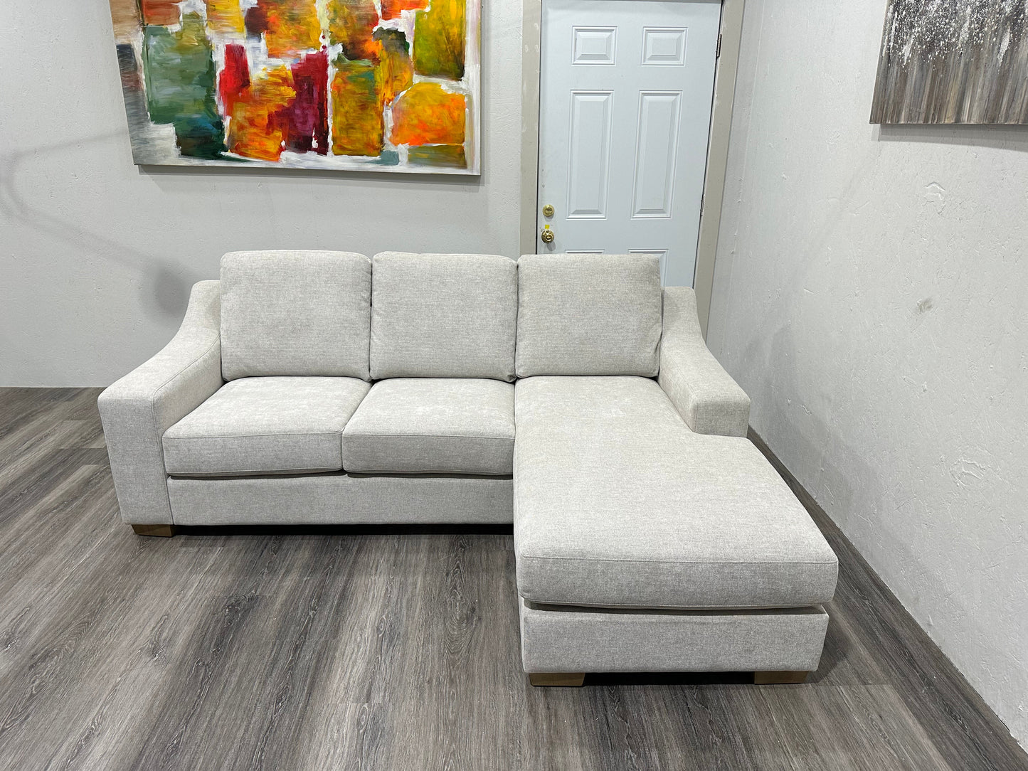 Beige sectional with reversible chase