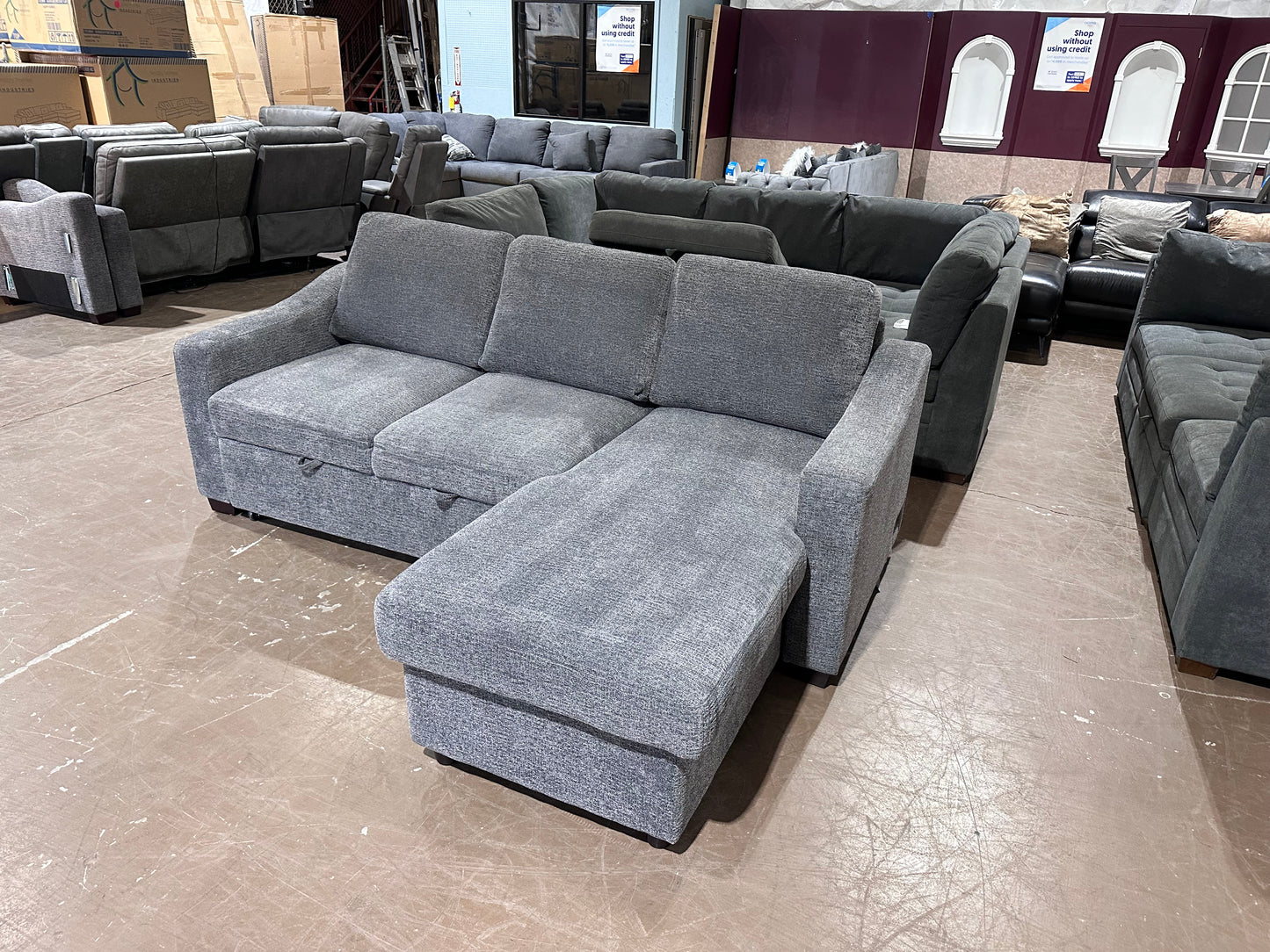 Gray sectional w/ pull out bed