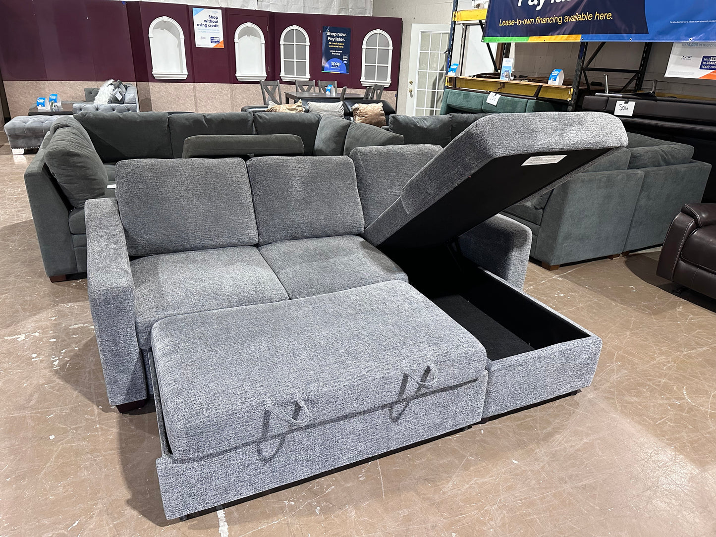 Gray sectional w/ pull out bed