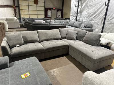 Light grey sofa with power leg rest