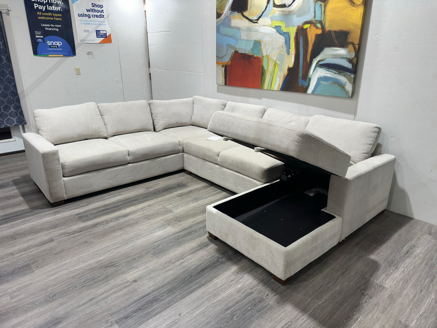 Three-piece beige sectional with storage Chase