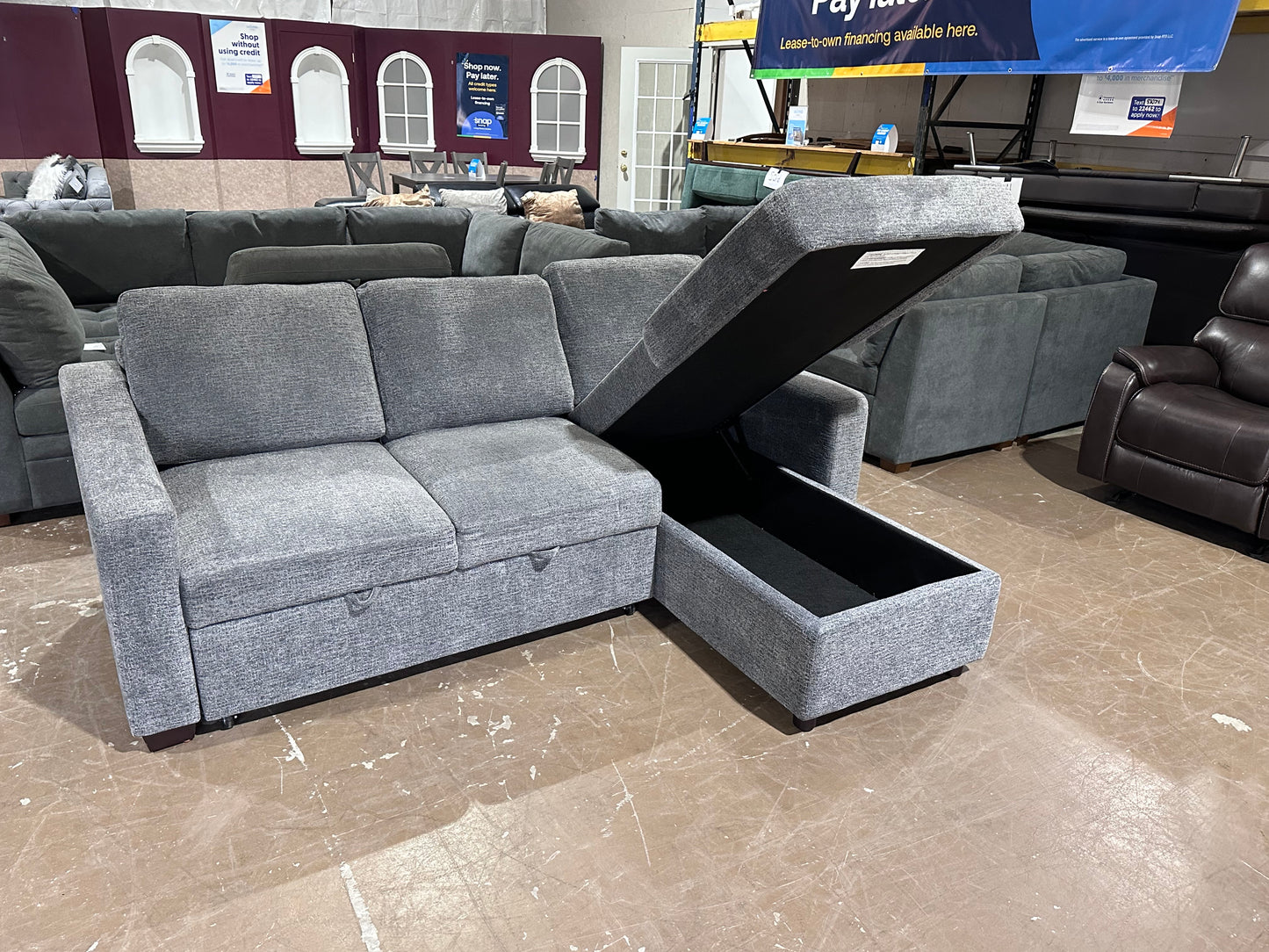 Gray sectional w/ pull out bed