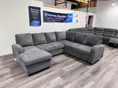 Navy Gray Sectional couch with storage compartment and pull out bed