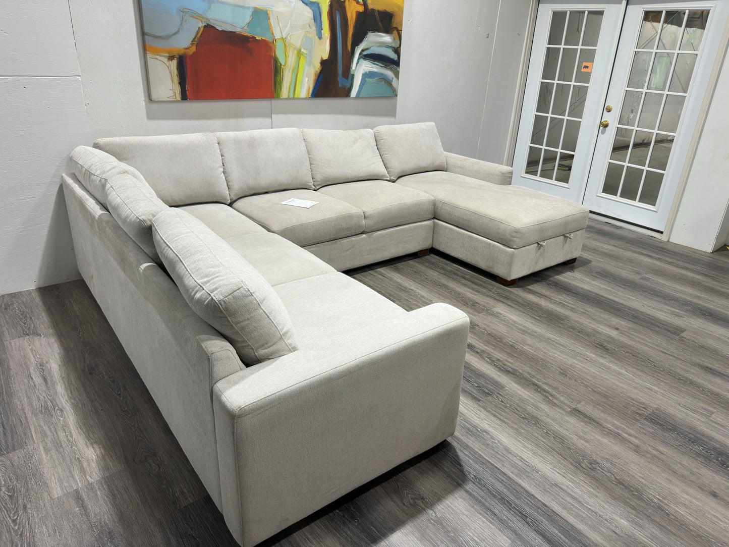 Three-piece beige sectional with storage Chase