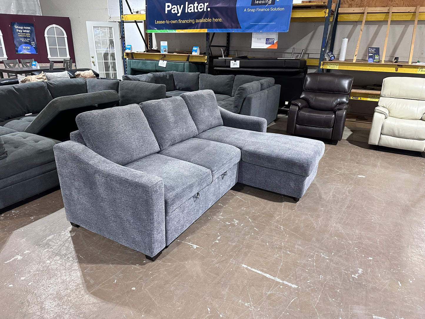 Gray sectional w/ pull out bed