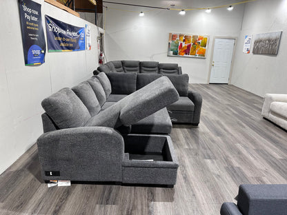 Navy Gray Sectional couch with storage compartment and pull out bed