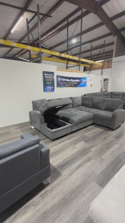 Navy Gray Sectional couch with storage compartment and pull out bed